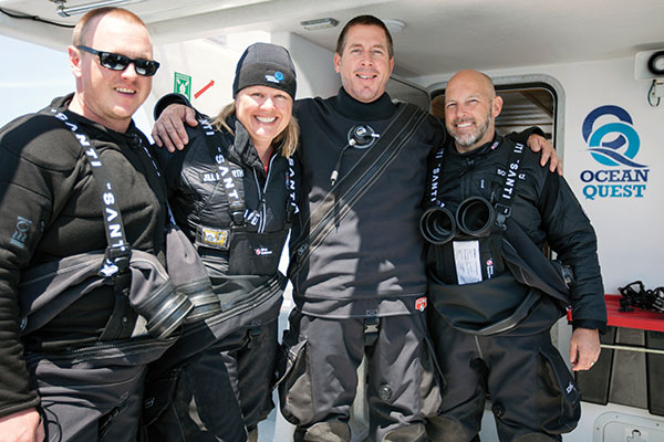 The author (second from left) is often one part of capable dive team, fortunate to venture where few women or men have ever been