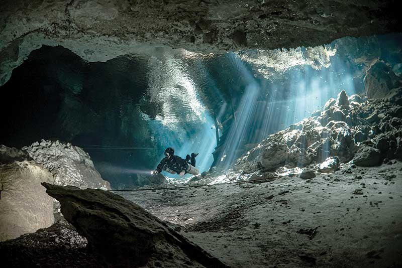 Cenote in the heart of a mystical jungle on Craiyon